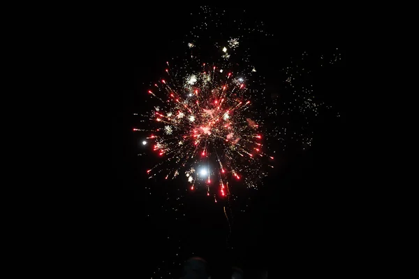 Cluster of colourful fireworks against dark sky — Stock Photo, Image