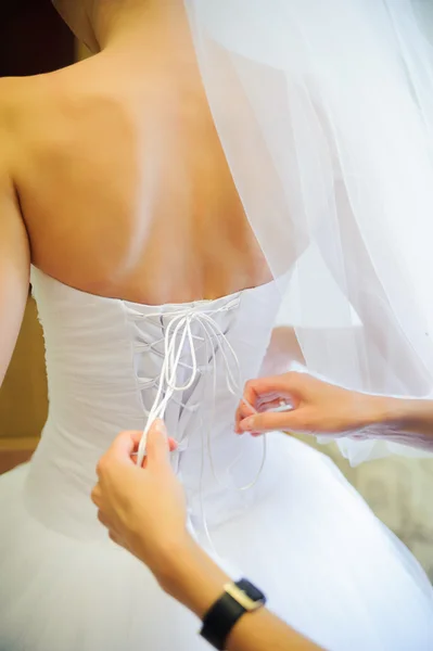 Bride getting dressed — Stock Photo, Image