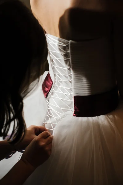 Bride getting dressed — Stock Photo, Image