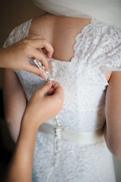 Bride getting dressed — Stock Photo, Image