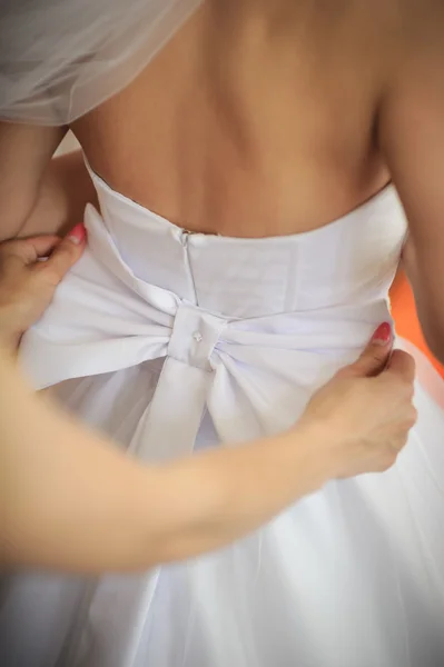 Bride getting dressed — Stock Photo, Image