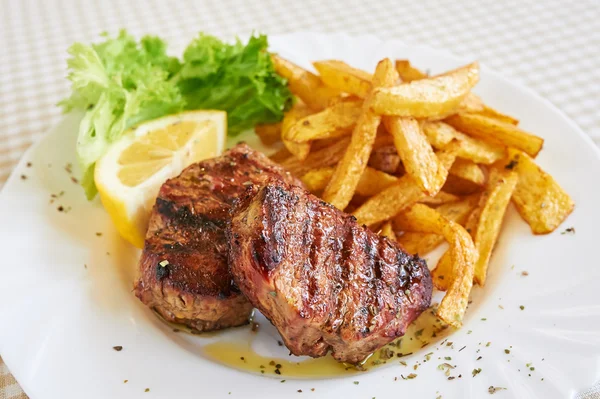 Grilled beefsteak with french fries Stock Photo