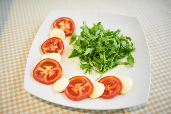 Tomato With Mozzarella With Arugula — Stock Photo, Image