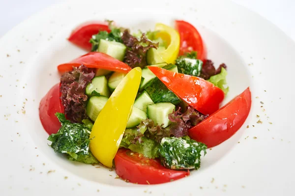 Greek salad on white plate — Stock Photo, Image