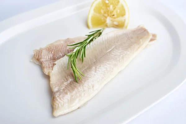 Trout fillet on white plate — Stock Photo, Image