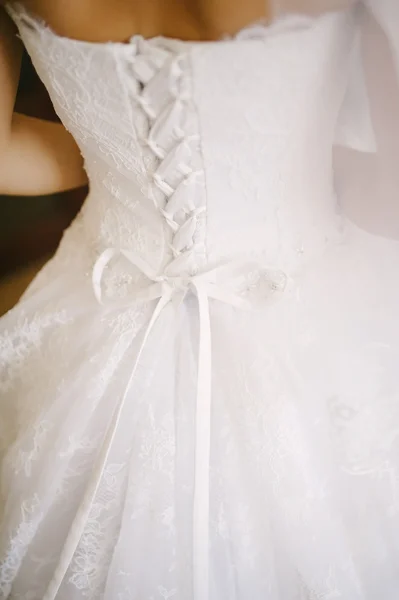 Bride getting dressed on her wedding day — Stock Photo, Image