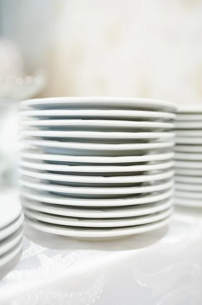 Stack of clean plates ready to be used on dinner