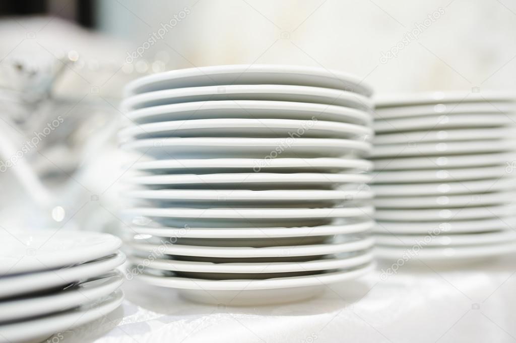 Stack of clean plates ready to be used on dinner