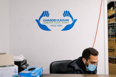 TORONTO, ONTARIO, CANADA - NOVEMBER 25, 2020: BOXES OF FOOD AT JEWISH FOOD BANK, FOOD FOR FAMILIES IN NEED OF HELP DURING COVID-19 PANDEMIC. clipart