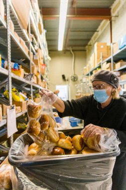 TORONTO, ONTARIO, CANADA - NOVEMBER 25, 2020: BOXES OF FOOD AT JEWISH FOOD BANK, FOOD FOR FAMILIES IN NEED OF HELP DURING COVID-19 PANDEMIC. clipart