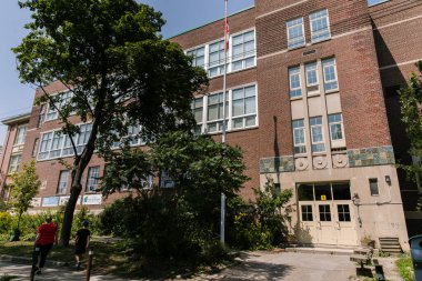 TORONTO, CANADA - AUGUST 21, 2017: FERN AVEUNE PUBLIC SCHOOL IN HIGH PARK/RONCESVALLES NEIGHBOURHOOD clipart
