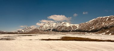 Panorama of snowy mountains, winter. clipart