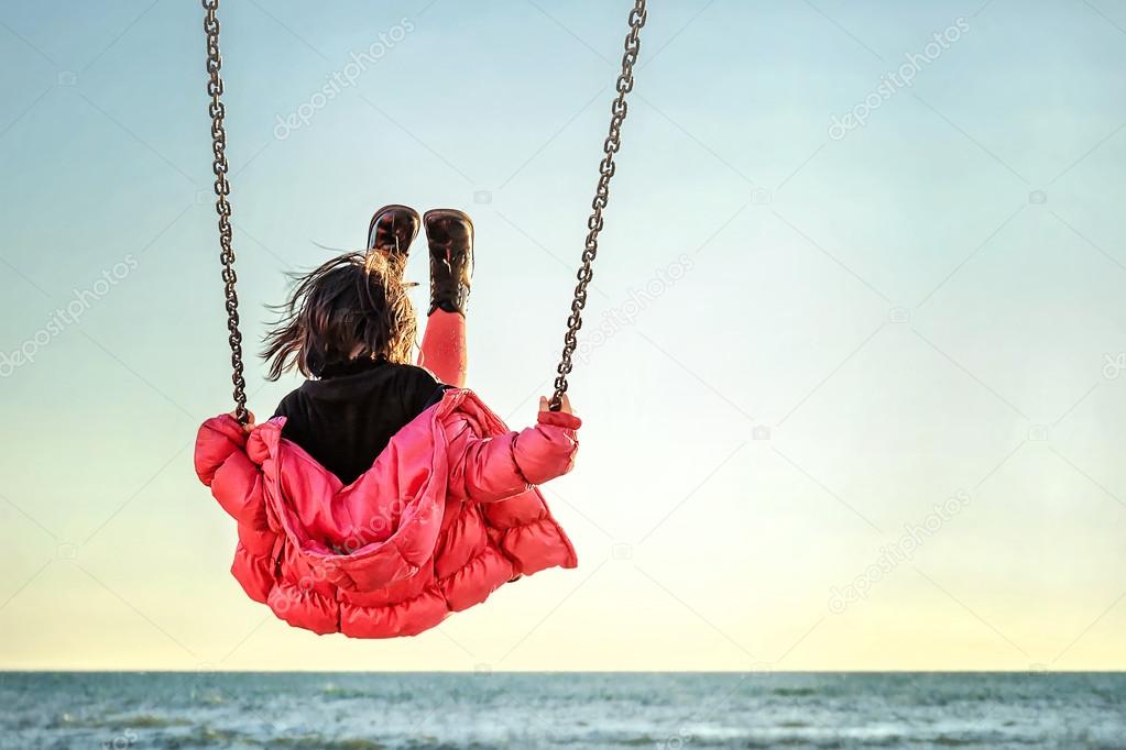 Little girl on the swing