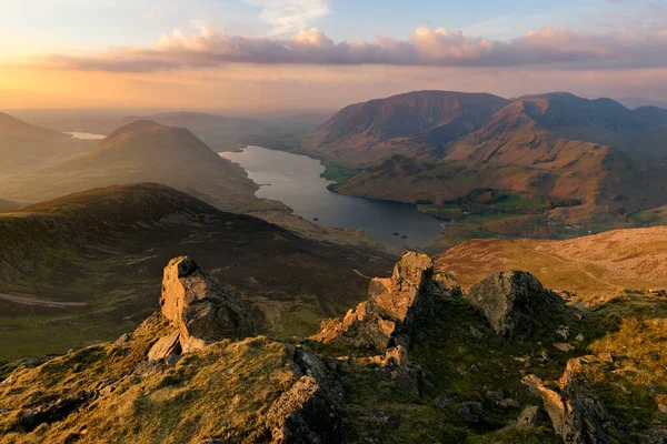 Aerial view of Crummock Water Lake at sunset from Red Pike in the Lake District.