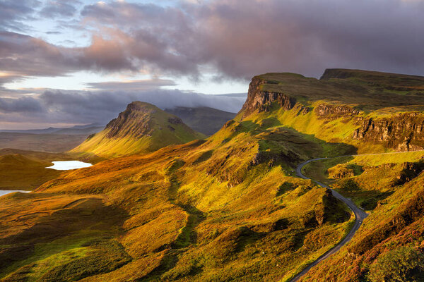 Scenic view of famous Scottish landscape the Quiraing with beautiful morning sunlight on mountains. Isle of Skye, Scotland, UK.