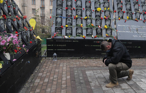 Laying flowers at the portraits of the fallen Heroes of the Heavenly Hundred on the Alley of Heroes of the Heavenly Hundred, on the Day of Dignity and Freedom, in Kiev, November 21, 2020