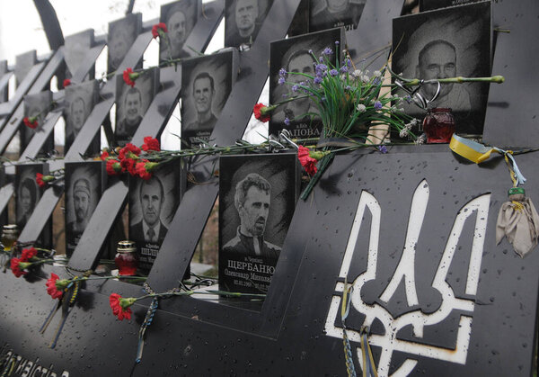 Flowers at the portraits of the fallen Heroes of the Heavenly Hundred, on the Alley of Heroes of the Heavenly Hundred, on the Day of Dignity and Freedom, in Kiev, November 21, 2020