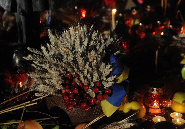 Spikelets with branches of viburnum near the sculpture "Bitter memory of childhood" on the Day of Remembrance of Victims of Holodomors ", in Kiev, November 28, 2020