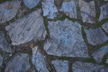 The pebble stone floors and wall, background textures in spain