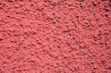 kaba alçı cephesi bir doku ya da arka plan gibi kırmızıya boyanmış. Yüksek kalite fotoğraf