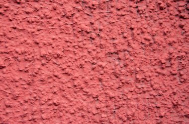 kaba alçı cephesi bir doku ya da arkaplan gibi kırmızıya boyanmış