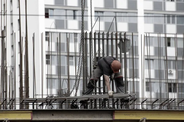 Workers and builders are building a housing complex made of concrete