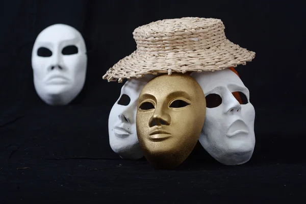 theatrical mask standing on a dark background