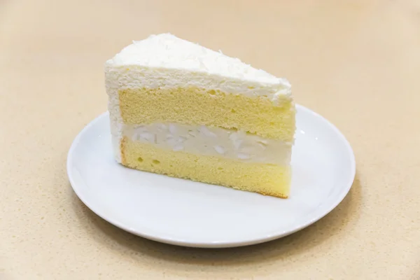 Fresh piece of coconut cream cake — Stock Photo, Image