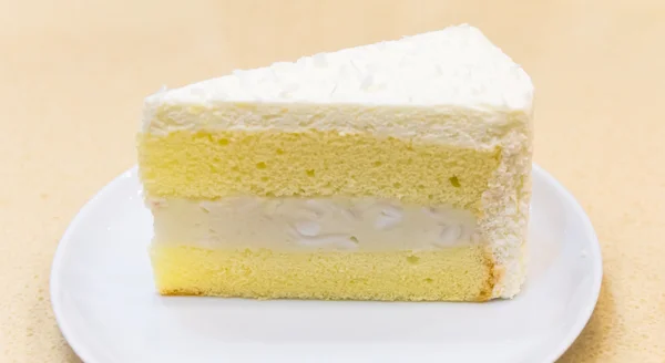 Fresh piece of coconut cream cake — Stock Photo, Image