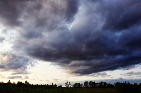 Dramatic black cloud before rainy.  Beautiful cloudscape over horizon, sky.
