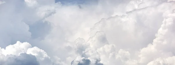 Abstract image of blurred sky. Blue sky background with cumulus clouds