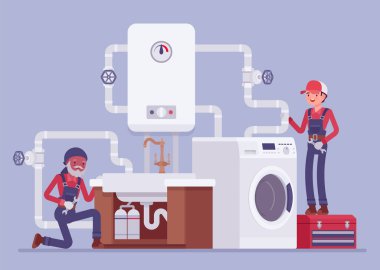 Profesyonel tesisatçılar mutfağa ya da banyoya su tesisatı kuruyor.