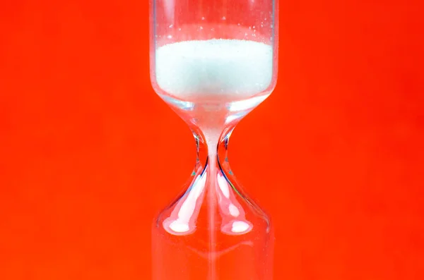 Sand Clock Red Background Hourglass Time Passing Concept Close Photo — Stock Photo, Image