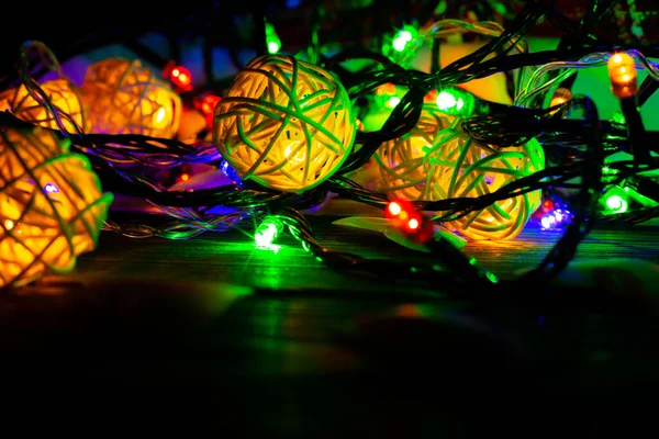 Christmas lights close up photo. Cozy mood in the evening. Festive time. Holidays concept. Happy New Year.