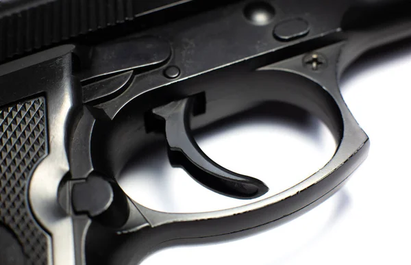 Тригер Чорного Пістолета Пістолет Лежить Білому Тлі Крупним Планом — стокове фото