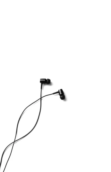 Black Earphones Lying White Background Modern Music Concept Audio Technology — Stock Photo, Image