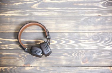 RIVNE, UKRAINE - February 10, 2020: Marshall leather headphones on vintage wooden background.