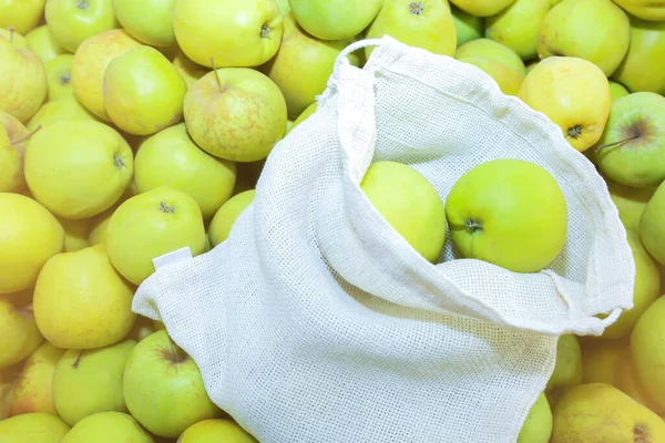 Reusable shopping bag with fruit. Zero waste. Ecologically and environmentally friendly packets. Canvas and linen fabrics. Save nature concept. No plastic single use in supermarkets.
