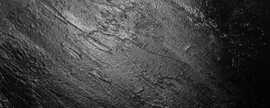 Siyah arkaplan dokusu. Geniş fırça darbeleri. Boyama dokunuşu. Ayın soyut duvar kağıdı.