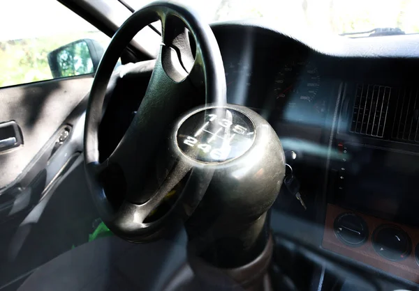 Manual transmission in the car. Old type of gearbox. Driver\'s wheel.