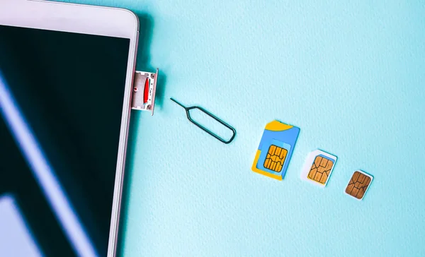 Modern Smartphone Lying Table Different Micro Nano Sim Cards Nearby — Stock Photo, Image