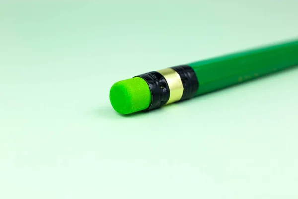 Close Green Pencil Eraser Green Background Minimalism Original Creative Photo — Stock Photo, Image