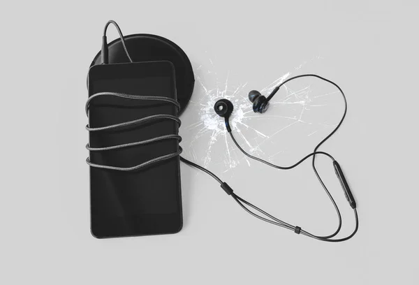 Czarny Smartfon Słuchawkami Leży Białym Tle Nowoczesne Połączenie Technologiczne Komórka — Zdjęcie stockowe