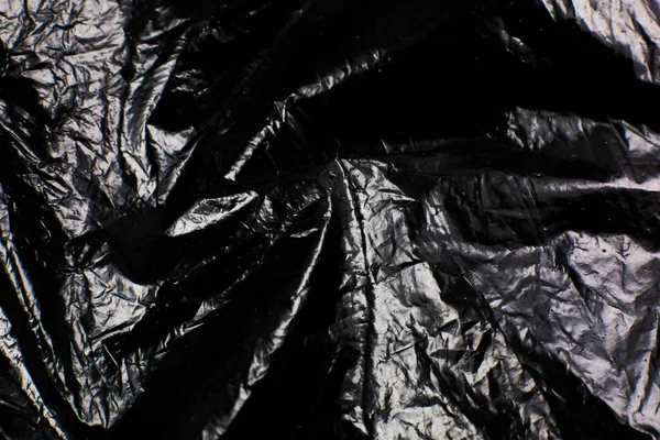Gyűrött Fekete Műanyag Táska Textúra Háttér Fényes Polietilén Fedőlap — Stock Fotó
