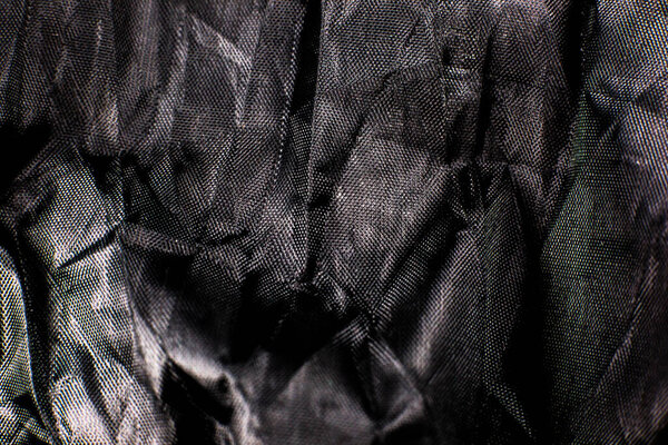 Black Crumpled braided cotton net texture background. Close up.