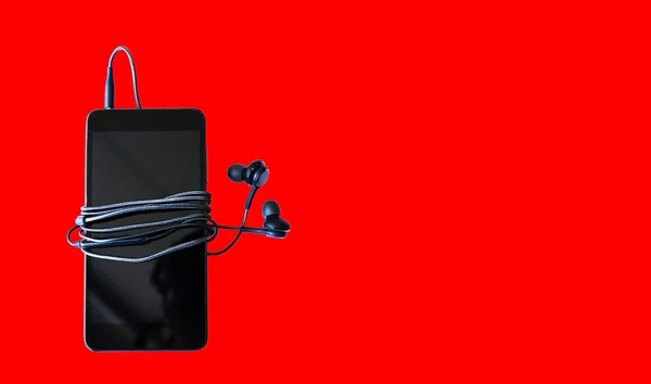 Black Smartphone Earphones Isolated Red Background Modern Technology Connection Digital — Stock Photo, Image