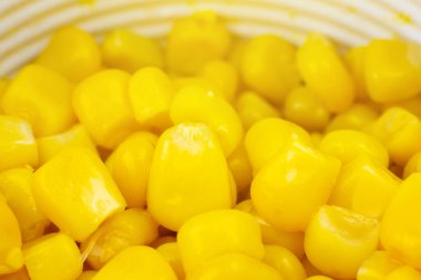 Konserve sarı mısır tohumları arka planı. Yaklaş, makro fotoğraf..