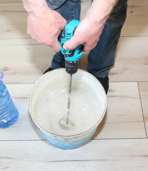 Man Mixing Spackling Glue Bucket Wallpaper Hanging Flat Restoration Indoors — Stock Photo, Image
