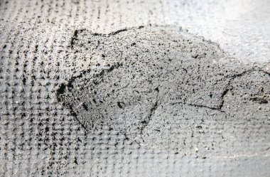 Gri arka plan açık havada. Kumaş dokusunda zemin.