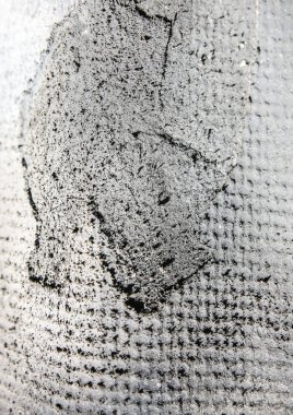 Gri arka plan açık havada. Kumaş dokusunda zemin.